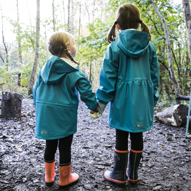 two girls in Grass & Air turquoise rain mac and wellies